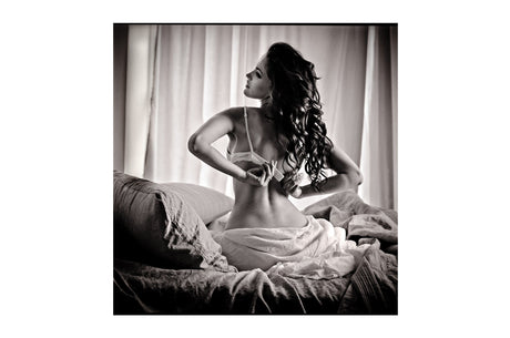 Glass picture Young woman in the bedroom 120cm x 120cm Homefactory 